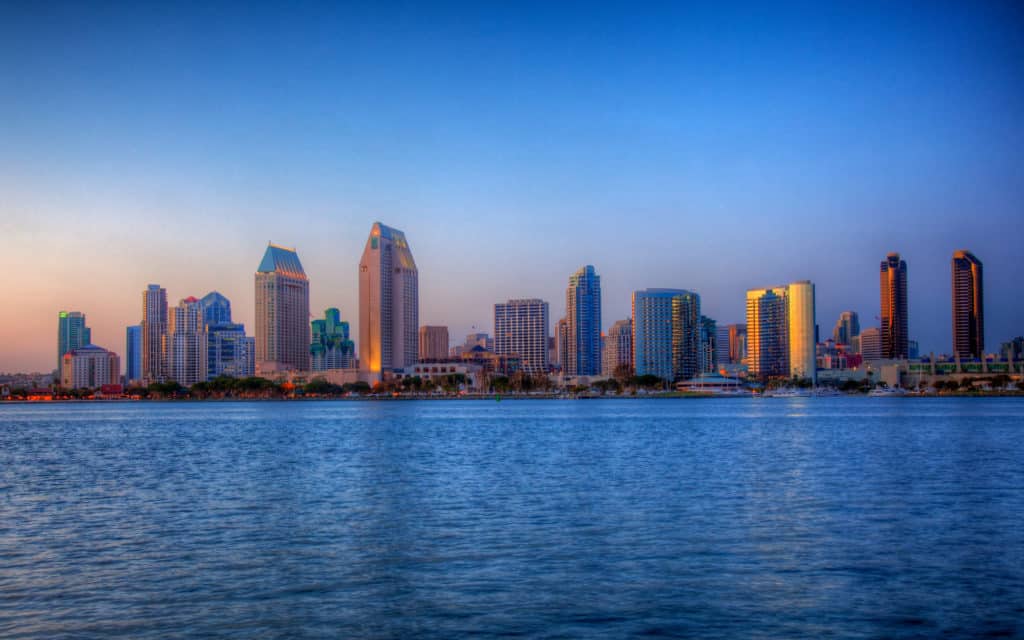 Sun setting lights up the buildings on San Diego seafront in HDR